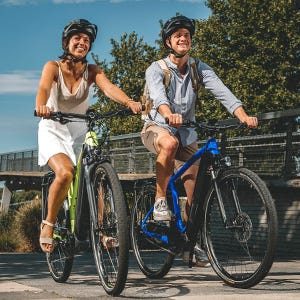 Two People Riding A Bike