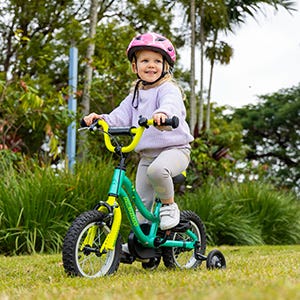 little girl riding a kids bike