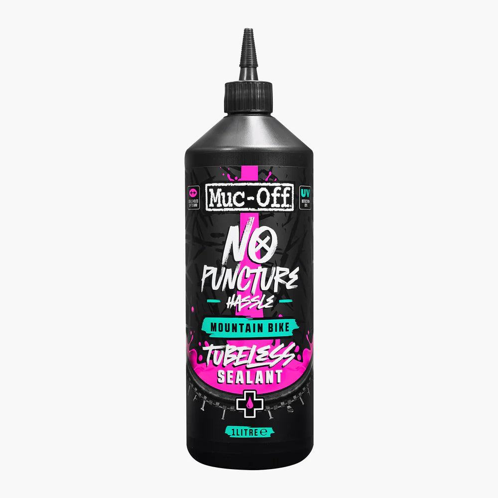 Muc-Off No Puncture Hassle tubeless sealant bottle on a white background